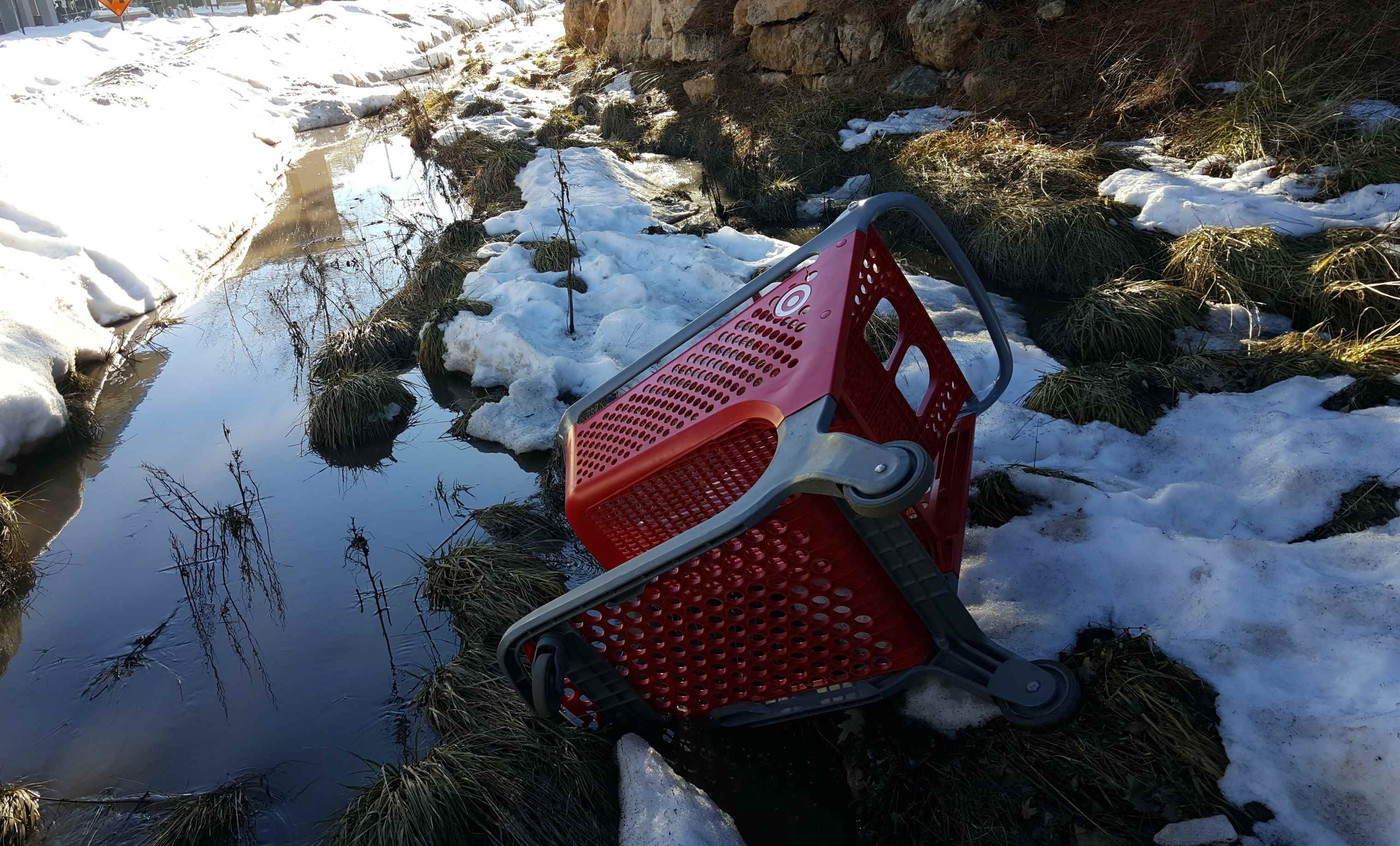 Image - Target Shopping Cart in Snowy Stream - Ped. Bridge near The Suites - Feb. 2017